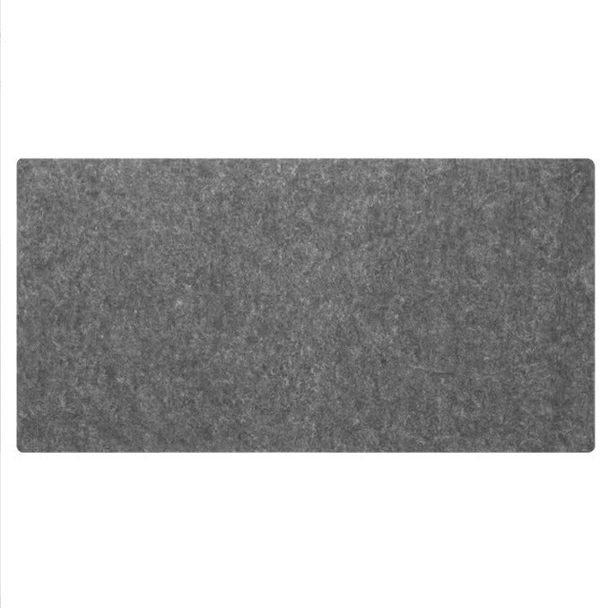 Extra large grey felt desk mat under a keyboard and mouse
