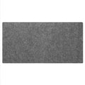 Extra large grey felt desk mat under a keyboard and mouse