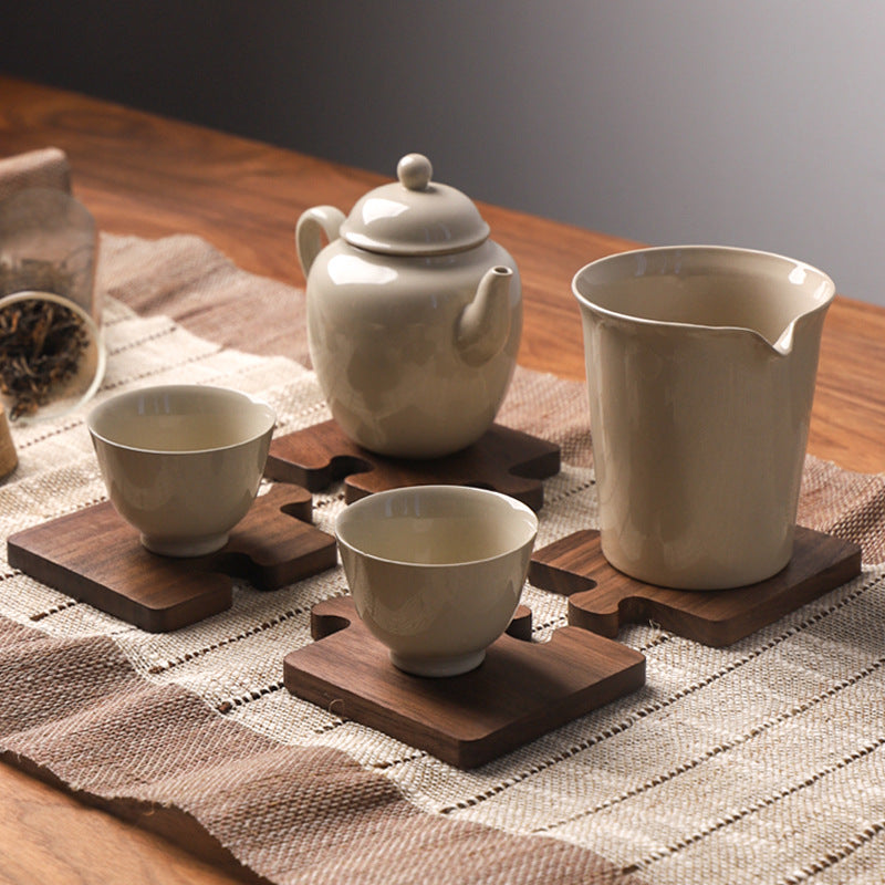 Puzzle coasters holding a coffee mug