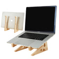Foldable wooden laptop stand holding an open laptop