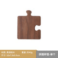 Walnut puzzle coaster set on a desk
